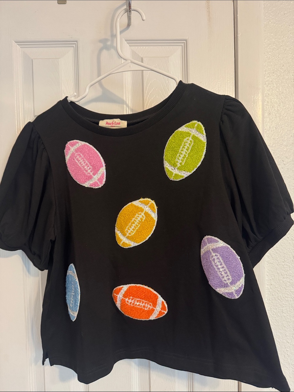 Peach Love California Black Short Sleeve Tee with Multicolor Football Appliqués